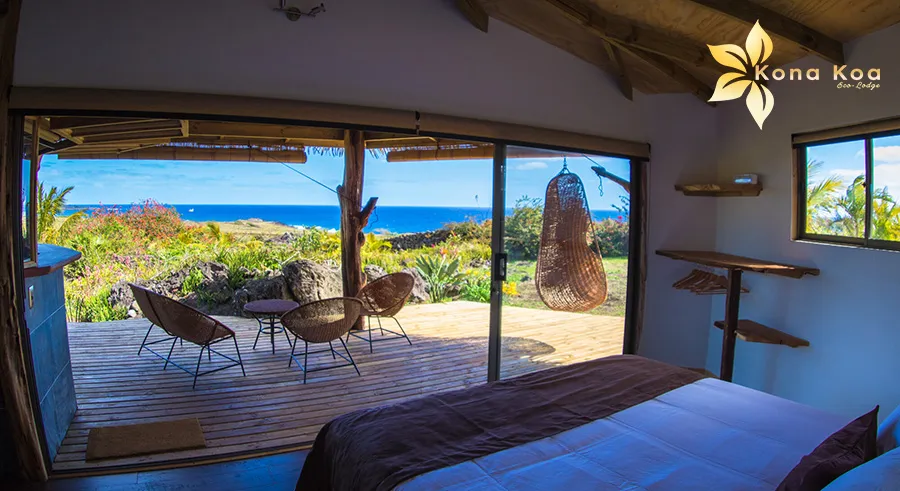 Bungalow terrace with thatched roof in a tropical garden, Kona Koa Eco Lodge.